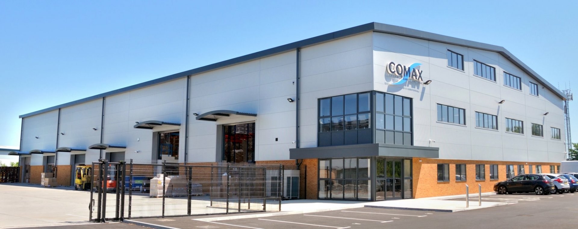 Full width shot Comax building cladded exterior