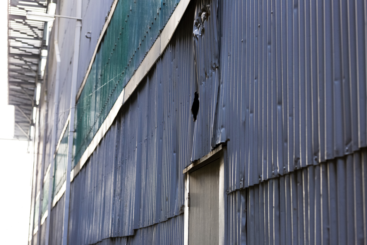 Damaged commercial cladding
